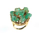Yellow gold emerald cocktail ring, tests 18 ct.