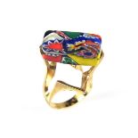 Gold plated psychedelic patterned ring.