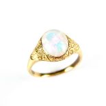 Yellow gold opal ring, tests 18 ct. The oval opal cabochon weighing approx. 1.