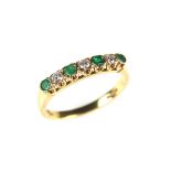 18 ct yellow gold emerald and diamond ring.