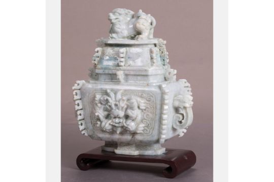 A Chinese Carved Celadon Nephrite Covered Vessel on a Carved Hardwood Stand.  H: 8 W: 7 1/4 D: 3 1/ - Image 1 of 10