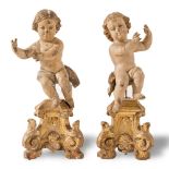 Couple of carved and lacquered wood sculpure depicting “Putti”, 18th Century, H of sculpture cm