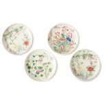 Four dishes with florar decorations, one of them with trademark of Guangxu period (1875-1908).