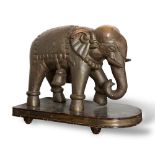 Wooden sculpture with rolled brass, “Elefante con paramenti”, wooden base, beginning of 20th