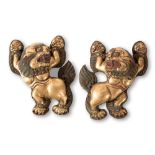 Couple of embossed copper snow lions, end od 19th Century, Tibet, H cm 30