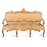 Divano in legno intagliato e dorato a motivi di conchiglia - volute ornamentali - sedile e schienale