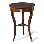 Walnut and gilt bronze mounted circular table, a drawer on the front, Emilia