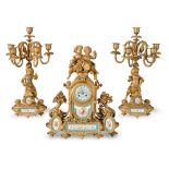 Gilt metal and Sèvres porcelain mantel clock and two candelabra, France, late 19th Century