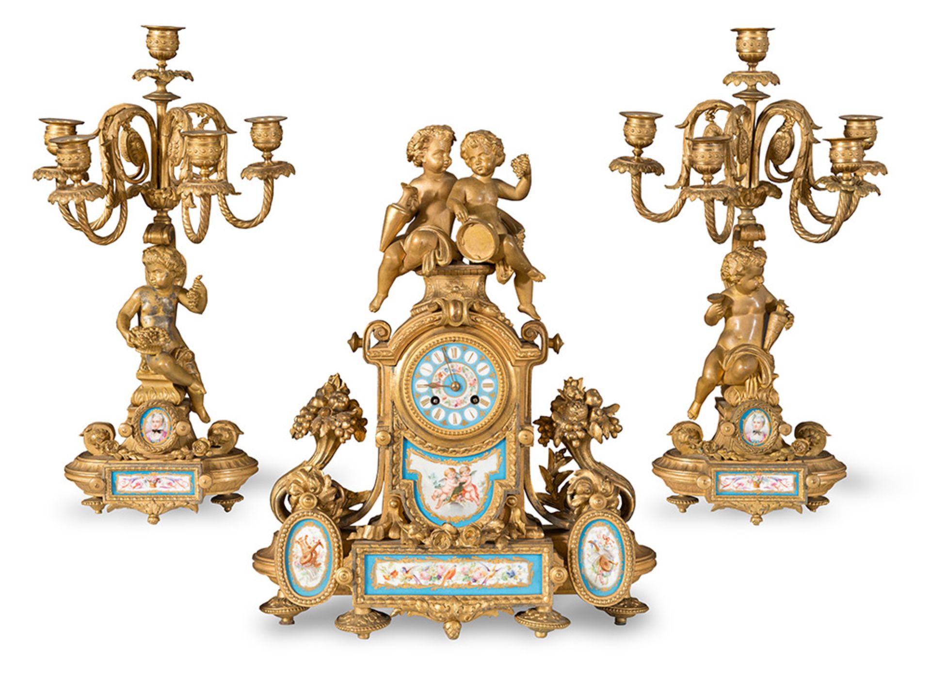 Gilt metal and Sèvres porcelain mantel clock and two candelabra, France, late 19th Century