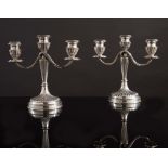 Pair of silver candlelabra.