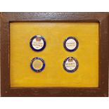 A set of 4 WWI enamel Railway Service Badges mounted in a small wooden frame and comprising: a