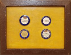 A set of 4 WWI enamel Railway Service Badges mounted in a small wooden frame and comprising: a