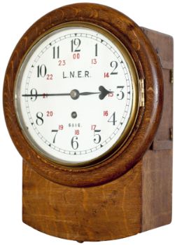 North Eastern Railway 8-inch oak cased iron dial railway clock with a cast brass bezel