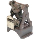 Edmondson ticket dating press, a rare early skeleton type. Cast iron with brass, stands 8in tall.