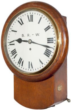 Somerset and Dorset Railway 10-inch oak cased iron dial railway clock with a spun brass bezel