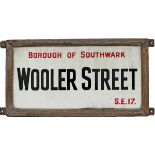 Enamel London street sign BOROUGH OF SOUTHWARK WOOLER ST SE17 complete with original wooden frame.