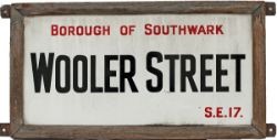 Enamel London street sign BOROUGH OF SOUTHWARK WOOLER ST SE17 complete with original wooden frame.