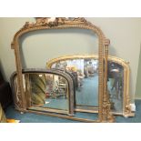 A 19th century gilt framed overmantel mirror with arched plate,