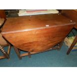 A 20th century mahogany drop leaf dining table