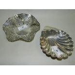 A silver shell moulded butter dish together with a silver pieced bon bon dish.