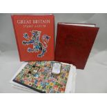 A collection of British stamps in stock book and albums and ten mint year packs etc.