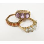 A 9ct gold three stone amethyst ring,