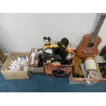 A box of LP records and 45rpm records, another box of decorative china and glass table bells,