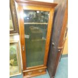 A Victorian oak gun cabinet with glazed door and drawer below (non compliant for guns)