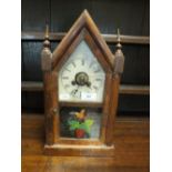 An American Jerome and Co. spring driven 'steeple' type mantel clock in pointed arched case.