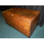 A large mahogany flat-top travel chest, having cast metal swing handles.