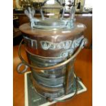 A ship's copper navigation light marked 'Meteorite' and with a sash embossed "anchor".