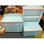 A child's blue painted bedroom chest of two short and two long drawers,