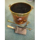 A copper and brass coal bucket, dated 1855 and a coal shovel, two pokers and brass coal tongs.