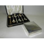 A set of six cased silver grapefruit spoons,