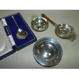 A cased reproduction silver seal top spoon with rose terminal together with a silver tea strainer