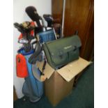 A selection of sporting equipment to include golf clubs and caddies,