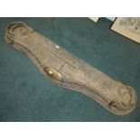 A late Victorian cast iron and brass mounted openwork fender,