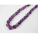 A faceted graduated amethyst necklace, with gilt metal screw fastening,