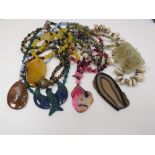 A collection of various hardstone and ornamental necklaces, to include; a pink banded agate example,