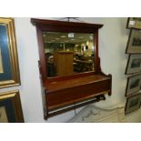 An Edwardian walnut hall mirror companion with integral glove box and scarf rail.