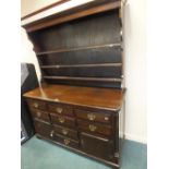 A 19th century crossbanded oak dresser base with three frieze drawers,