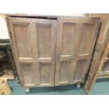 An 18th / 19th century oak two door panel cupboard and a separate panel (for restoration)