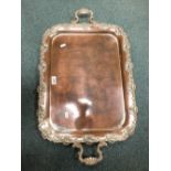 A 19th century Sheffield plate rectangular tray with foliate grape and vine cast border.