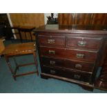 A Victorian stained deal chest of two short and two long drawers and an oak occasional table on