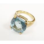 A single stone blue topaz dress ring, the yellow metal shank not stamped,