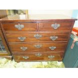 A 19th century mahogany chest of two short and three long drawers with replaced oak top.