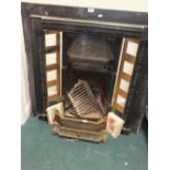A Victorian style fire surround grate,
