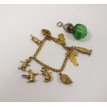 A 9ct gold curb link charm bracelet, with attached yellow metal charms,
