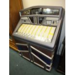 A Rowe AMI Juke box playing 45rpm records from the 1950s, 60s and 70s (needs servicing).