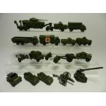 Eighteen unboxed Dinky Army vehicles dating from the 1950s suitable for spares or renovation,